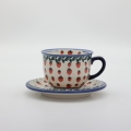 Cup with saucer A44 D139 – hand-painted Bolesławiec pottery with traditional blue-and-white design, elegant for serving coffee and tea.