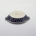 Hand decorated round baking dish with handles made from authentic Boleslawiec pottery.