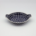 Hand decorated round baking dish with handles made from authentic Boleslawiec pottery.