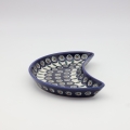 Unique Bolesławiec tray in crescent shape, perfect for serving snacks.