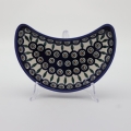 Unique Bolesławiec tray in crescent shape, perfect for serving snacks.