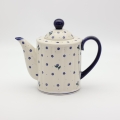 Detail of hand-painted decoration on Boleslawiec teapot A72 D122 – traditional Polish pottery.