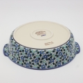 Round ceramic serving dish with handles – Bolesławiec pottery, hand-decorated with traditional patterns. Perfect for serving meats, salads, and appetizers. Stylish and durable Polish ceramic.