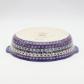 Round ceramic serving platter with handles – hand-decorated Bolesławiec pottery with traditional patterns. Perfect for serving meats, salads, snacks, and family dishes. Durable and elegant Polish ceramic.