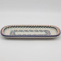 Hand-painted ceramic serving platter made from traditional Bolesławiec pottery. Perfect for serving food and decorating the table.