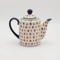 Hand-painted striped teapot made from traditional Bolesławiec pottery. A stylish and functional piece perfect for serving tea and decorating the kitchen.