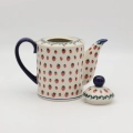 Hand-painted striped teapot made from traditional Bolesławiec pottery. A stylish and functional piece perfect for serving tea and decorating the kitchen.