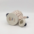 Hand-painted striped teapot made from traditional Bolesławiec pottery. A stylish and functional piece perfect for serving tea and decorating the kitchen.