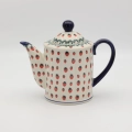 Hand-painted striped teapot made from traditional Bolesławiec pottery. A stylish and functional piece perfect for serving tea and decorating the kitchen.