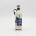 Hand-painted 0.8L ceramic bottle with cork made from traditional Bolesławiec pottery. Perfect for storing liqueurs, olive oil, water, or as a kitchen decoration.