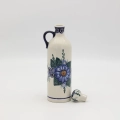 Hand-painted 0.8L ceramic bottle with cork made from traditional Bolesławiec pottery. Perfect for storing liqueurs, olive oil, water, or as a kitchen decoration.