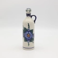 Hand-painted 0.8L ceramic bottle with cork made from traditional Bolesławiec pottery. Perfect for storing liqueurs, olive oil, water, or as a kitchen decoration.
