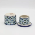 Hand-painted water butter dish made from traditional Bolesławiec pottery. A practical kitchen accessory designed to keep butter fresh and spreadable longer.
