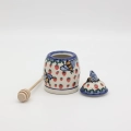 Hand-painted honey pot made from traditional Bolesławiec pottery. A stylish and practical container perfect for storing and serving honey.