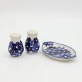 Hand-painted salt and pepper shakers with tray made from traditional Bolesławiec pottery. A stylish set perfect for everyday use and elegant table settings.